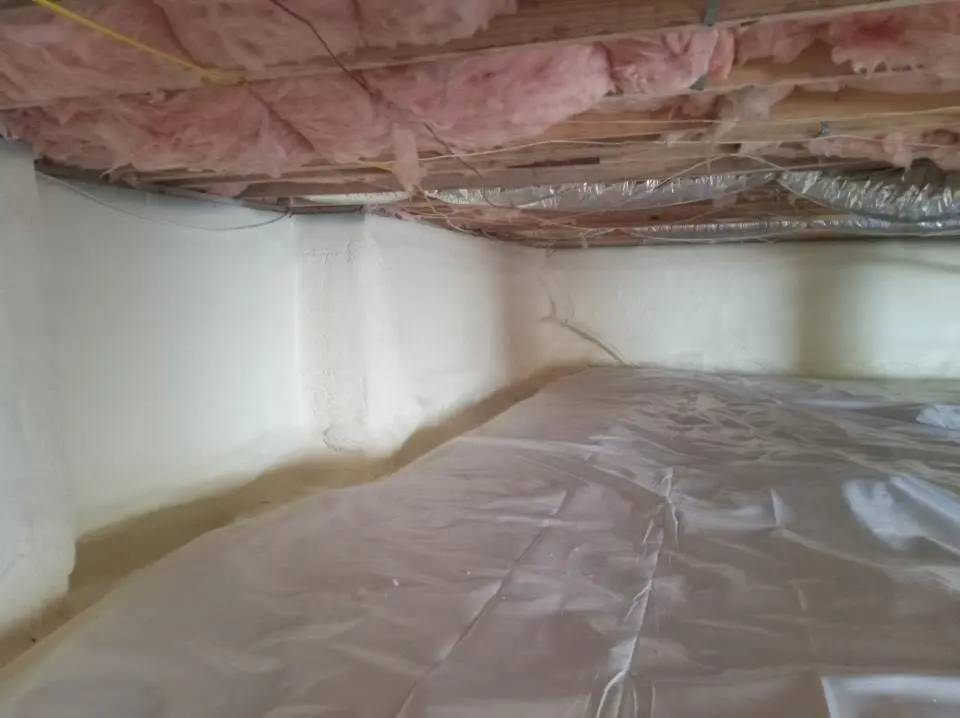 Crawl space encapsulation with closed-cell spray foam for Commercial Roof Restoration in Laurens